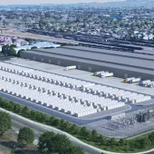 A vast battery storage array from the air in the middle of a metropolitan area