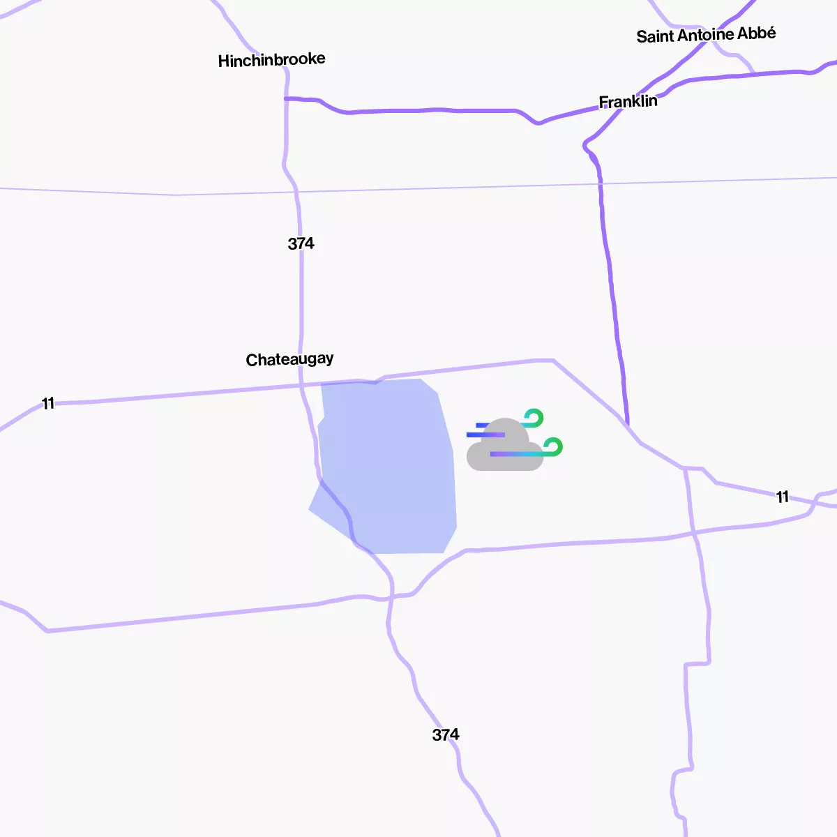 A map showing roads and towns including Hinchinbrooke, Franklin, and Chateauguay. A blue area represents a body of water near Chateauguay. A cloud icon with wind symbols is placed near the water, indicating weather conditions.