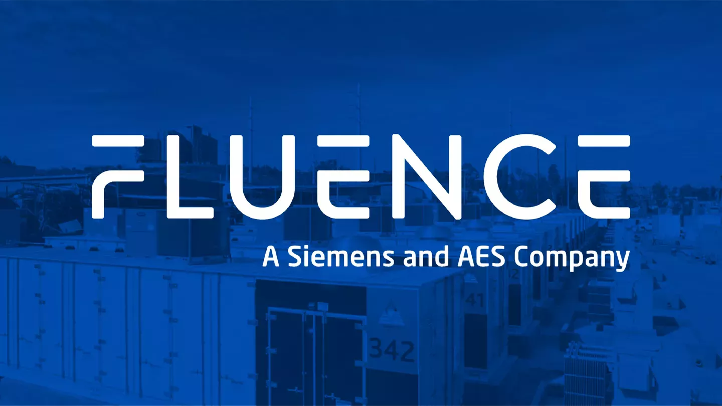 Fluence logo with the text 'A Siemens and AES Company' over a blue-toned image of industrial buildings.